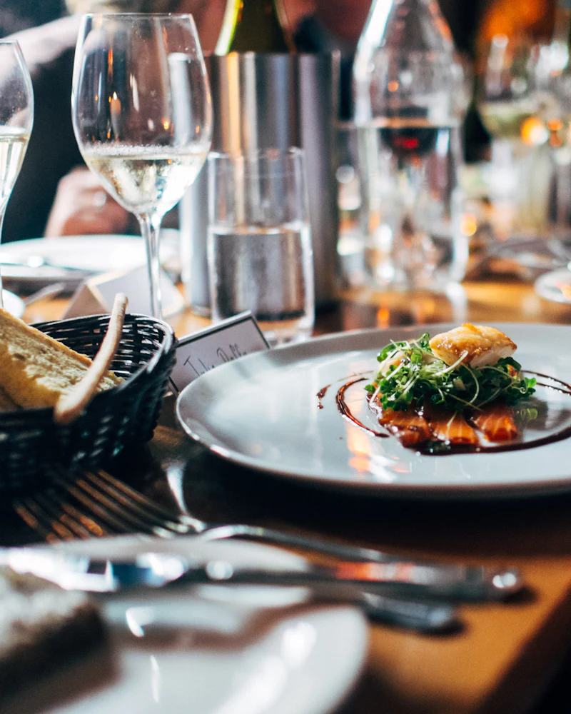 A plated dish at a set table in the Uvendra restaurant