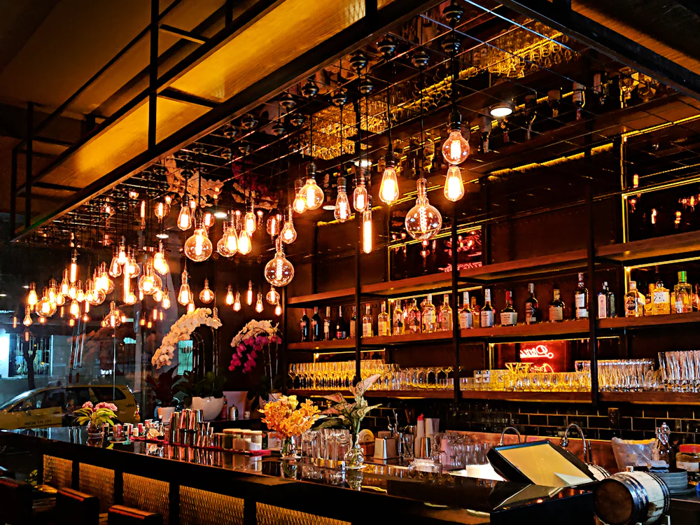 The Uvendra bar with pendant lights in the evening